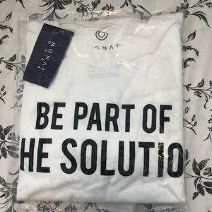 New Monat white shirt says be part of the solution size medium